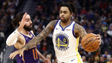 Ricky Rubio defiende a D&#039;Angelo Russell durante un Golden State Warriors-Phoenix Suns.