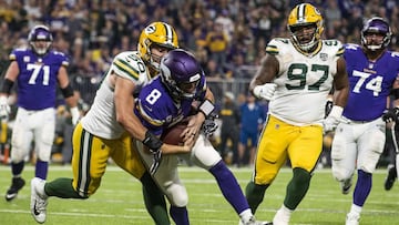 MINNEAPOLIS, MN - NOVEMBER 25: Kirk Cousins #8 of the Minnesota Vikings is tackled with the ball by Blake Martinez #50 of the Green Bay Packers third quarter of the game at U.S. Bank Stadium on November 25, 2018 in Minneapolis, Minnesota.   Stephen Mature