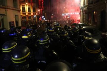 French riot police march towards English football fans as they clash on June 15, 2016 in Lille, France. Police used tear gas and pepper spray on the fans in a bid to keep public order in the city centre.