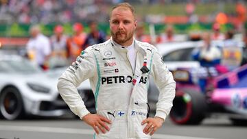 Mercedes&#039; Finnish driver Valtteri Bottas gestures in parc ferme after his second place in the British Formula One Grand Prix at the Silverstone motor racing circuit in Silverstone, central England, on July 14, 2019. - Lewis Hamilton extended his lead at the top of the Formula One championship on Sunday after winning the British Grand Prix for a record sixth time. (Photo by Andrej ISAKOVIC / AFP)