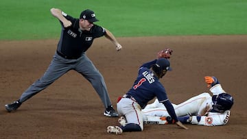 HOUSTON, TEXAS - OCTOBER 26: Yuli Gurriel #10 of the Houston Astros is tagged out at second base by Ozzie Albies #1 of the Atlanta Braves during the eighth inning in Game One of the World Series at Minute Maid Park on October 26, 2021 in Houston, Texas.  