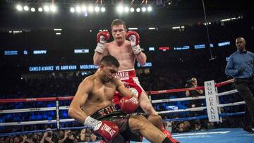 May 7, 2016; Las Vegas, NV, USA; Canelo Alvarez (red shorts) knocks out Amir Khan (maroon shorts) during their middleweight boxing title fight at T-Mobile Arena. Mandatory Credit: Joshua Dahl-USA TODAY Sports