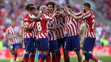 Atletico Madrid's French forward Antoine Griezmann (2nd-L) celebrates with teammates after scoring his team's second goal during the Spanish league football match between Club Atletico de Madrid and UD Almeria at the Wanda Metropolitano stadium in Madrid on April 16, 2023. (Photo by Pierre-Philippe MARCOU / AFP)