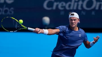 Aug 13, 2025; Cincinnati, OH, USA; Holger Rune (DEN) returns a shot against Frances Tiafoe (USA) during the Cincinnati Open at the Lindner Family Tennis Center. Mandatory Credit: Aaron Doster-Imagn Images