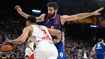 AS Monaco's French guard #02 Elie Okobo drives the ball against Barcelona's Spanish guard #09 Ricky Rubio during the Euroleague basketball match between FC Barcelona and AS Monaco at the Palau Blaugrana arena in Barcelona, on March 1, 2024. (Photo by Josep LAGO / AFP)