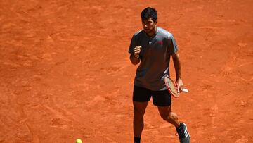 Chile&#039;s Christian Garin celebrates winning a point against Russia&#039;s Daniil Medvedev during their 2021 ATP Tour Madrid Open tennis tournament singles match  at the Caja Magica in Madrid on May 6, 2021. (Photo by GABRIEL BOUYS / AFP)