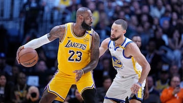 LOS ANGELES, CALIFORNIA - APRIL 03: LeBron James #23 of the Los Angeles Lakers controls the ball against Stephen Curry #30 of the Golden State Warriors during the second half of a game at Crypto.com Arena on April 03, 2025 in Los Angeles, California. NOTE TO USER: User expressly acknowledges and agrees that, by downloading and or using this photograph, User is consenting to the terms and conditions of the Getty Images License Agreement. Michael Owens/Getty Images/AFP (Photo by Michael Owens / GETTY IMAGES NORTH AMERICA / Getty Images via AFP)
