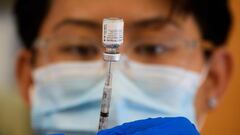 A healthcare worker prepares a dose of the Pfizer Covid-19 vaccine at a Los Angeles County mobile vaccination clinic in Los Angeles, California. 