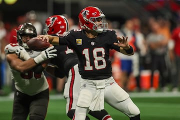 Atlanta Falcons quarterback Kirk Cousins attempts to throw against the Tampa Bay Buccaneers.