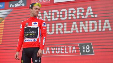 Mitchelton-Scott's British cyclist Simon Philip Yates celebrates on the podium retaining the general rank leader's Red Jersey after the 19th stage of the 73rd edition of "La Vuelta" Tour of Spain cycling race, a 154.4 km flat route fro