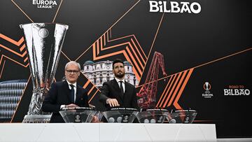Former Spanish player Artiz Aduriz (R) picks a name next to UEFA Deputy General Secretary Giorgio Marchetti during the 2024-2025 UEFA Europa League football tournament knockout play-off draw at the House of European Football in Nyon, on January 31, 2025. (Photo by Fabrice COFFRINI / AFP)