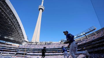 TORONTO, ONTARIO - OCTOBER 05: Daulton Varsho #5 of the Toronto Blue Jays warms up before game two against the New York Yankees of the American League Division Series at Rogers Centre on October 05, 2025 in Toronto, Ontario. Mark Blinch/Getty Images/AFP (Photo by MARK BLINCH / GETTY IMAGES NORTH AMERICA / Getty Images via AFP)