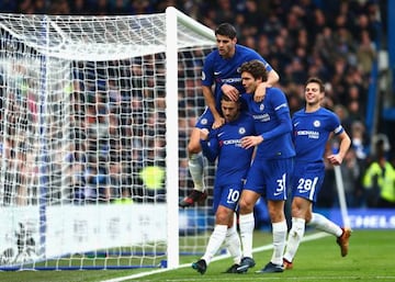 Eden Hazard celebrates after scoring his side's third goal with Alvaro Morata and Marcos Alonso during the Premier League match between Chelsea and Newcastle United at Stamford Bridge.