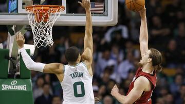 Dec 20, 2017; Boston, MA, USA; Miami Heat forward Kelly Olynyk (9) takes a shot while guarded by Boston Celtics forward Jayson Tatum (0) during the second half at TD Garden. Mandatory Credit: Greg M. Cooper-USA TODAY Sports