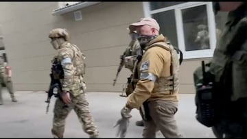 Founder of Wagner private mercenary group Yevgeny Prigozhin and Russian Wagner Group fighters are seen at the headquarters of the Southern Military District of the Russian Armed Forces in Rostov-on-Don, Russia, in this screen grab from a video released on June 24, 2023. Video Obtained by REUTERS. THIS IMAGE HAS BEEN SUPPLIED BY A THIRD PARTY. NO RESALES. NO ARCHIVES.