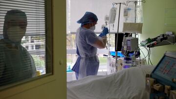 Nurses wearing protective masks and protective suits, work in the Intensive Care Unit (ICU) where patients suffering from the coronavirus disease (COVID-19) are treated at the Le Bois private hospital in Lille, France, October 28, 2020. REUTERS/Pascal Rossignol