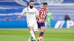 Dani Carvajal y Nahuel Molina, en una jugada del derbi de Liga Real Madrid-Atlético disputado en febrero de 2023 en el Santiago Bernabéu.