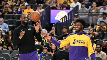 Oct 15, 2024; Las Vegas, Nevada, USA; Los Angeles Lakers forward LeBron James (23) warms up with guard Bronny James (9) before the preseason game against the Golden State Warriors at T-Mobile Arena. Mandatory Credit: Candice Ward-Imagn Images