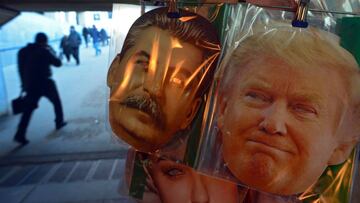 Face masks depicting Soviet leader Joseph Stalin and US President-elect Donald Trump are displayed for sale at a kiosk in an underground passage in Saint Petersburg on January 20, 2017.
 Donald Trump will be sworn in as the 45th president of the United States Friday -- capping his improbable journey to the White House and beginning a four-year term that promises to shake up Washington and the world. / AFP PHOTO / Olga MALTSEVA