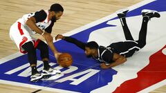 LAKE BUENA VISTA, FLORIDA - AUGUST 19: Fred VanVleet #23 of the Toronto Raptors steals the ball from Garrett Temple #17 of the Brooklyn Nets during the fourth quarter in Game Two of the Eastern Conference First Round during the 2020 NBA Playoffs at The Fi