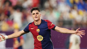 Barcelona's Spanish forward #08 Pau Victor celebrates after scoring a goal during the pre-season club friendly football match between Real Madrid and Barcelona at MetLife Stadium in East Rutherford, New Jersey, August 3, 2024. (Photo by Charly TRIBALLEAU / AFP)
