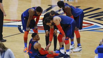 Jan 27, 2019; Oklahoma City, OK, USA; Oklahoma City Thunder guard Russell Westbrook (0) is surrounded by his teammates following running into Milwaukee Bucks guard George Hill, not seen, and grabbing his knee at the end of the second quarter at Chesapeake Energy Arena. Mandatory Credit: Alonzo Adams-USA TODAY Sports