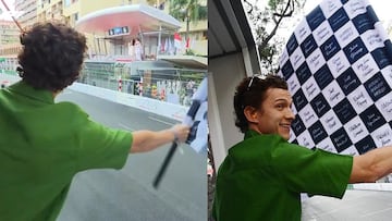 Tom Holland waves checkered flag at Monaco Grand Prix