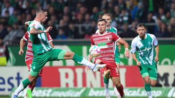 dpatop - 09 September 2022, Bremen: Soccer: Bundesliga, Werder Bremen - FC Augsburg, Matchday 6, wohninvest Weserstadion. Werder's Marco Friedl (l) fights Augsburg's Ermedin Demirovic for the ball. Photo: Carmen Jaspersen/dpa - IMPORTANT NOTE: In accordance with the requirements of the DFL Deutsche Fußball Liga and the DFB Deutscher Fußball-Bund, it is prohibited to use or have used photographs taken in the stadium and/or of the match in the form of sequence pictures and/or video-like photo series. (Photo by Carmen Jaspersen/picture alliance via Getty Images)