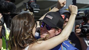 Scott Dixon, right, of New Zealand, celebrates with his wife Emma after winning the pole during qualifications for the Indianapolis 500 IndyCar auto race at Indianapolis Motor Speedway, Sunday, May 21, 2017, in Indianapolis. (AP Photo/Michael Conroy)