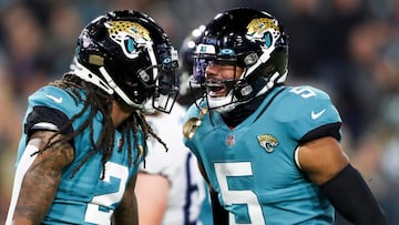 JACKSONVILLE, FLORIDA - JANUARY 07: Rayshawn Jenkins #2 of the Jacksonville Jaguars and Andre Cisco #5 of the Jacksonville Jaguars react after a defensive play during the second quarter against the Tennessee Titans at TIAA Bank Field on January 07, 2023 in Jacksonville, Florida.   Courtney Culbreath/Getty Images/AFP (Photo by Courtney Culbreath / GETTY IMAGES NORTH AMERICA / Getty Images via AFP)