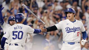 Los Angeles (United States), 06/10/2024.- Los Angeles Dodgers' Shohei Ohtani (R) high fives Los Angeles Dodgers' Mookie Betts after both scoring during the Major League Baseball (MLB) National League Division Series playoff game one between the San Diego Padres and the Los Angeles Dodgers in Los Angeles, California, USA, 05 October 2024. The series is the best-of-five games. EFE/EPA/ALLISON DINNER