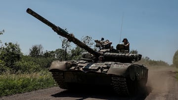 FILE PHOTO: Ukrainian servicemen of the 30th Kostiantyn Ostrozkyi Separate Mechanized Brigade ride in a T-80 main battle tank captured earlier from Russian troops, along a road near the front line town of Bakhmut, amid Russia's attack on Ukraine, in Donetsk region, Ukraine June 19, 2023. Radio Free Europe/Radio Liberty/Serhii Nuzhnenko via REUTERS/File Photo