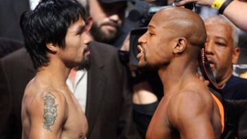 Los boxeadores Manny Pacquiao y Floyd Mayweather frente a frente antes de su combate.