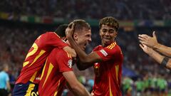 Spain's forward #10 Daniel Olmo (C) celebrates with Spain's forward #19 Lamine Yamal France's own goal and Spain's second goal following his kick during the UEFA Euro 2024 semi-final football match between Spain and France at the Munich Football Arena in Munich on July 9, 2024. (Photo by FRANCK FIFE / AFP)