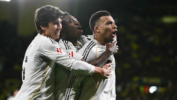 Real Madrid's French forward #10 Kylian Mbapp (R) celebrates with Real Madrid's Brazilian forward #07 Vinicius Junior (C) and Real Madrid's Spanish forward #16 Gonzalo Garcia after scoring his team's second goal from the penalty spot during the Spanish league football match between Villarreal CF and Real Madrid CF at La Ceramica Stadium in Vila-Real on January 24, 2026. (Photo by JOSE JORDAN / AFP)