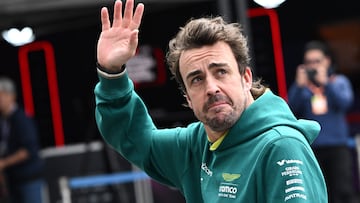 Aston Martin's Spanish driver Fernando Alonso waves after taking part in the third practice session for the Formula One Japanese Grand Prix race at the Suzuka circuit in Suzuka, Mie prefecture on April 6, 2024. (Photo by Philip FONG / AFP)