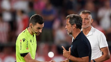 Referee Alejandro Muñiz Ruiz and Quique Sanchez Flores head coach of Getafe talk after the La Liga Santander match between Girona FC and Getafe CF at Montilivi Stadium on August 22, 2022 in Girona, Spain. (Photo by Jose Breton/Pics Action/NurPhoto via Getty Images)