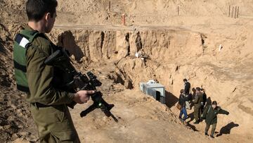 FILE PHOTO: An Israeli soldier keeps guard next to an entrance to what the Israeli military say is a cross-border attack tunnel dug from Gaza to Israel, on the Israeli side of the Gaza Strip border near Kissufim  January 18, 2018. REUTERS/Jack Guez/Pool/File Photo