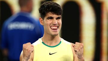 Spain's Carlos Alcaraz celebrates winning against France's Richard Gasquet during their men's singles match on day three of the Australian Open tennis tournament in Melbourne on January 16, 2024. (Photo by Martin KEEP / AFP) / -- IMAGE RESTRICTED TO EDITORIAL USE - STRICTLY NO COMMERCIAL USE --