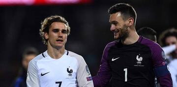 France's forward Antoine Griezmann (L) and France's goalkeaper Hugo Lloris react at the end of the FIFA World Cup 2018 qualifying football match Luxembourg vs France on March 25, 2017 at the Josy Bartel stadium in Luxembourg.