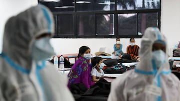 FILE PHOTO: A woman sits with her child inside a quarantine centre for the coronavirus disease (COVID-19) patients amidst the spread of the disease at an indoor sports complex in New Delhi, India, September 22, 2020. REUTERS/Anushree Fadnavis/File Photo