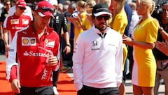 SPA, BELGIUM - AUGUST 23: Sebastian Vettel of Germany and Ferrari and Fernando Alonso of Spain and McLaren Honda arrive for the drivers' parade before the Formula One Grand Prix of Belgium at Circuit de Spa-Francorchamps on August 23, 2015 in Spa, Belgium. (Photo by Charles Coates/Getty Images)  PUBLICADA 15/06/16 NA MA36 3COL
