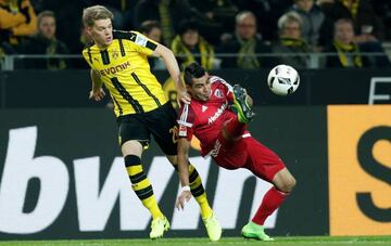 Matthias Ginter battles with Ingolstadt's Dario Lezcano Farina