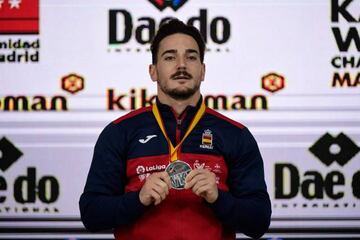 Spain's Damian Quintero Capdevila poses with his silver medal on the podium after winning the Kata individual male competition during the 24th Karate World Championships at the WiZink center in Madrid on November 10, 2018. (Photo by JAVIER SORIANO / AFP)