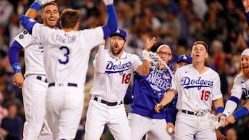 The Los Angeles Dodgers celebrate the walk-off two-run home run hit by left fielder Chris Taylor (3) against the St. Louis Cardinals during the ninth inning at Dodger Stadium. 