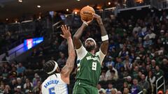 Milwaukee Bucks guard Malik Beasley (5) takes a shot againstOrlando Magic forward Paolo Banchero (5) in the first quarter at Fiserv Forum.