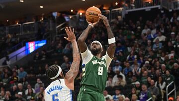 Milwaukee Bucks guard Malik Beasley (5) takes a shot againstOrlando Magic forward Paolo Banchero (5) in the first quarter at Fiserv Forum.