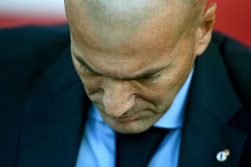 Real Madrid's French coach Zinedine Zidane looks downwards during the Spanish league football match Girona FC vs Real Madrid CF at the Municipal de Montilivi stadium in Girona on October 29, 2017. .