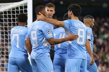 MANCHESTER, ENGLAND - SEPTEMBER 15: Gabriel Jesus of Manchester City celebrates with teammate Ruben Dias and Ilkay Guendogan after scoring their side's sixth goal during the UEFA Champions League group A match between Manchester City and RB Leipzig at Eti