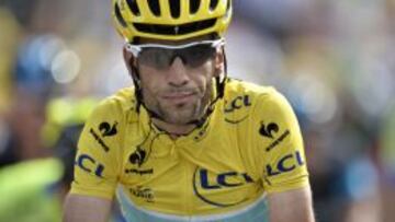 Italy's Vincenzo Nibali wearing the overall leader's yellow jersey reacts as he crosses the finish line at the end of the 170 km ninth stage of the 101st edition of the Tour de France cycling race on July 13, 2014 between Gerardmer and Mulhouse, eastern France. Germany's Tony Martin won the stage. AFP PHOTO / JEFF PACHOUD